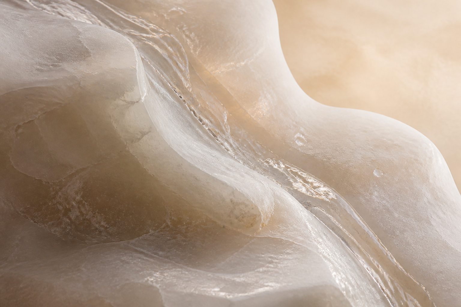 Water over pale alabaster stone